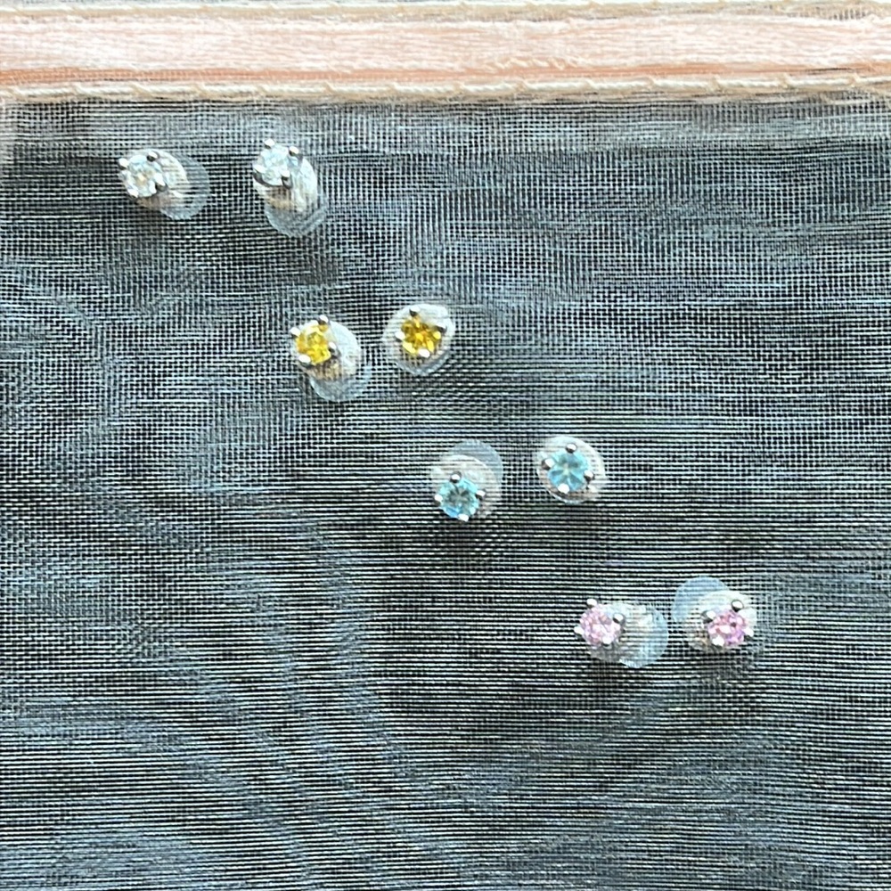 NWOT set of 4 sterling silver CZ Mini stud earrings Clear, pink, blue, & yellow.